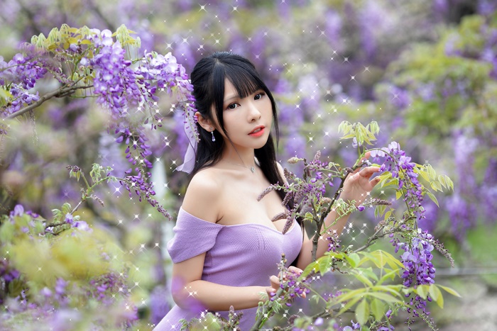 Asian Woman with Black Hair Among Purple Flowers 4K