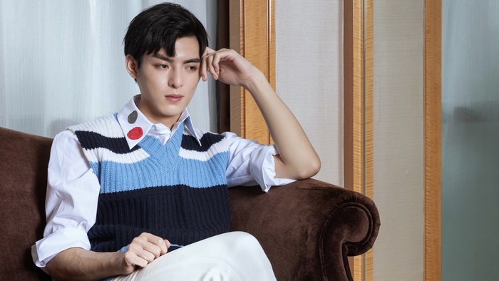 Wang Hao Xuan sitting on a couch