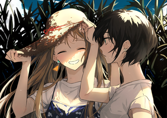 Two girls in a garden with a straw hat