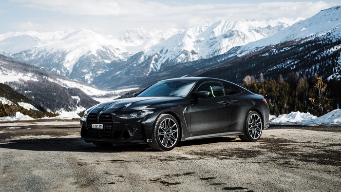 Black BMW M4 Coupe in Snowy Mountains