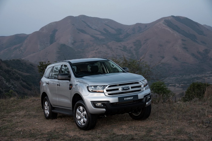 Silver Ford Everest SUV parked on a hill