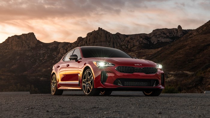 Red Kia Stinger 4K car in mountains