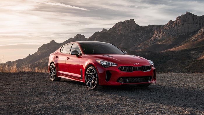 Red Kia Stinger 4K car in mountains