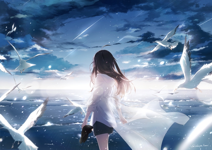 Girl with black hair and seagulls by the ocean