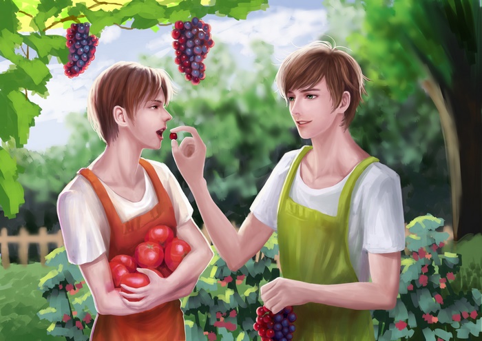 Two young men picking fruit in a garden