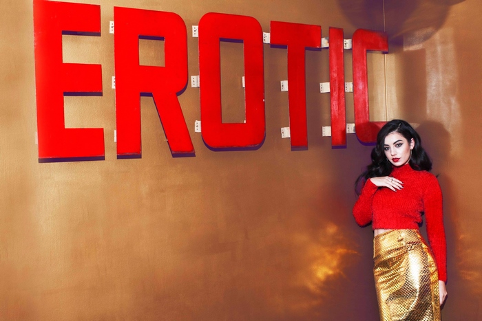 Charli XCX in front of EROTIC sign