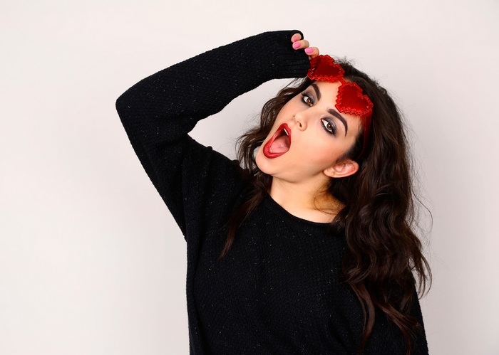 Charli XCX wearing heart-shaped glasses