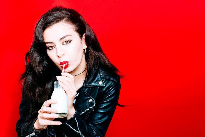 Charli XCX drinking from a bottle