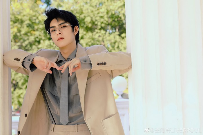 Wang Hao Xuan in a beige suit