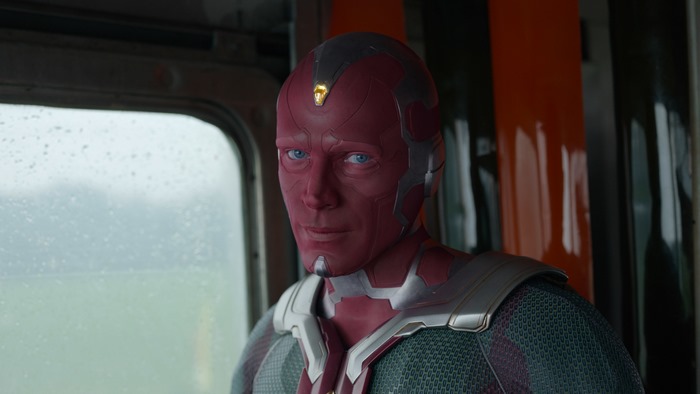 Vision from Marvel Comics in a train