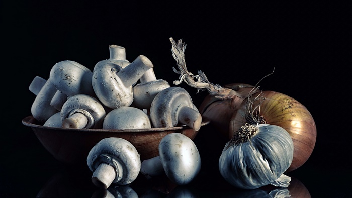 Mushrooms, Onion, and Garlic on Black Background