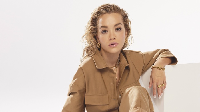 Rita Ora in a tan jumpsuit