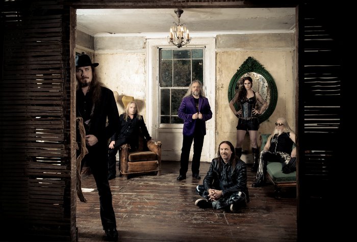 Nightwish band members in a room