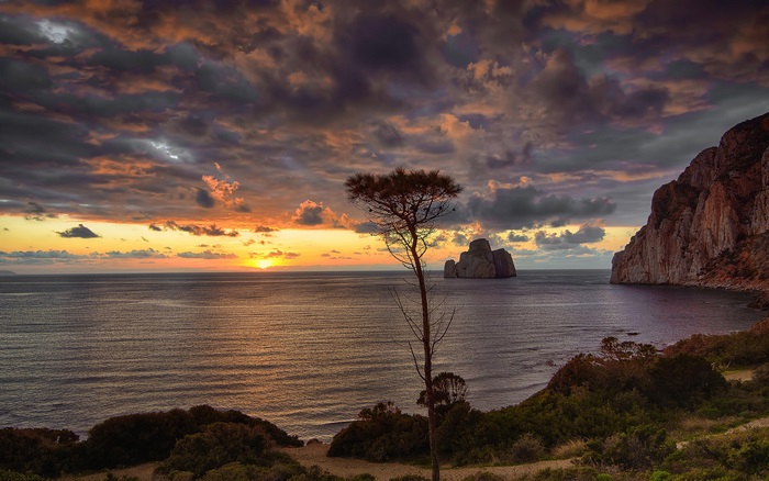 Sunset over the sea with rock formations
