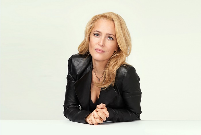 Gillian Anderson in a black leather jacket