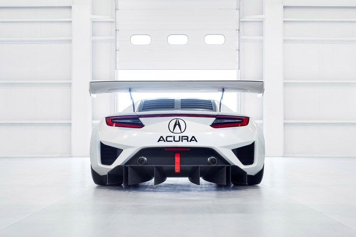 White Acura NSX GT3 race car with large rear wing