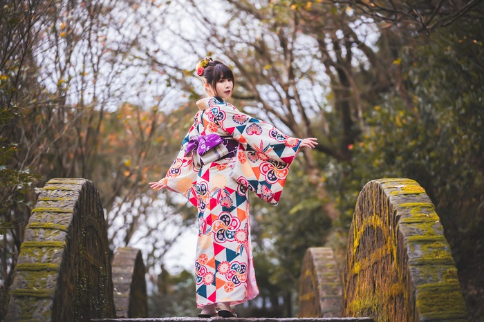 Woman in Kimono on Stone Bridge
