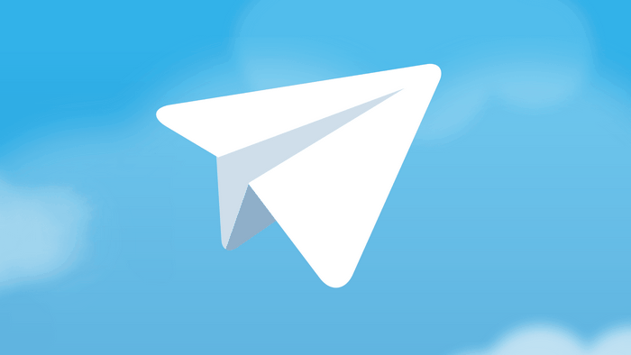 Telegram logo paper airplane on blue sky