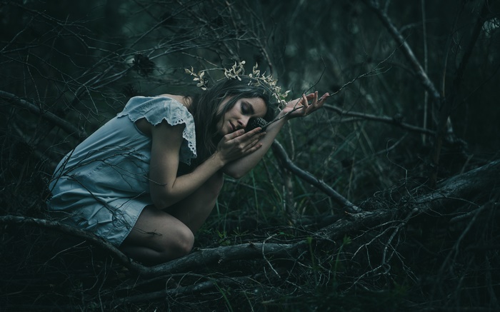 Model in a forest with a crown