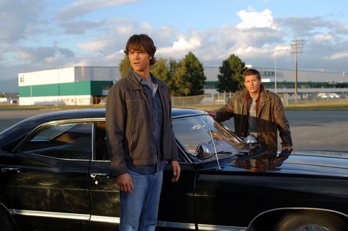 Sam and Dean Winchester from Supernatural with their car
