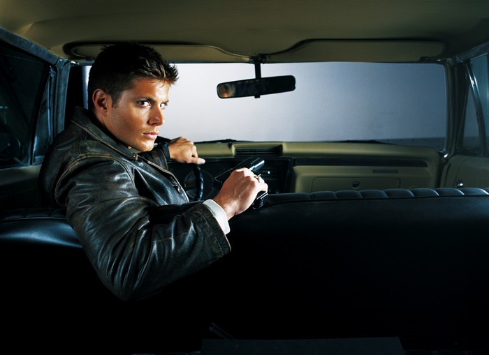 Dean Winchester from Supernatural holding a gun