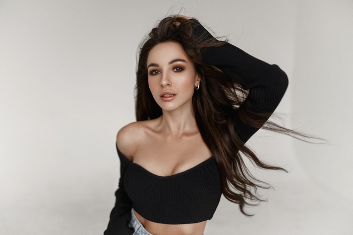 Woman with long brown hair and makeup
