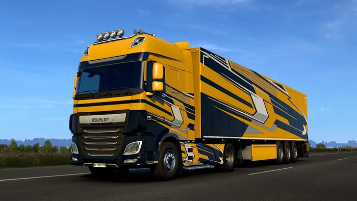Yellow and black DAF HD truck on a highway