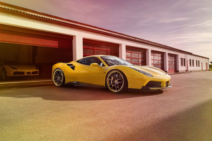 Yellow Novitec Rosso Ferrari 488 GTB parked outside garage