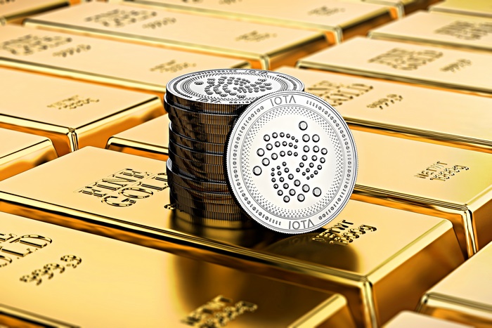 IOTA Cryptocurrency Coins Stacked on Gold Bars