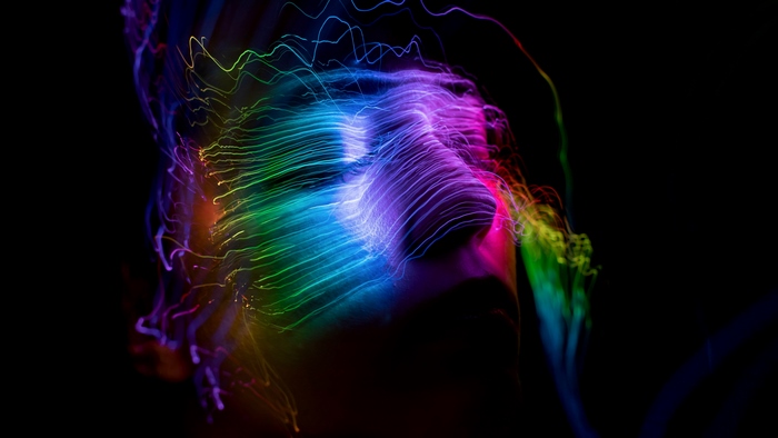 Abstract Face with Colorful Light Streaks