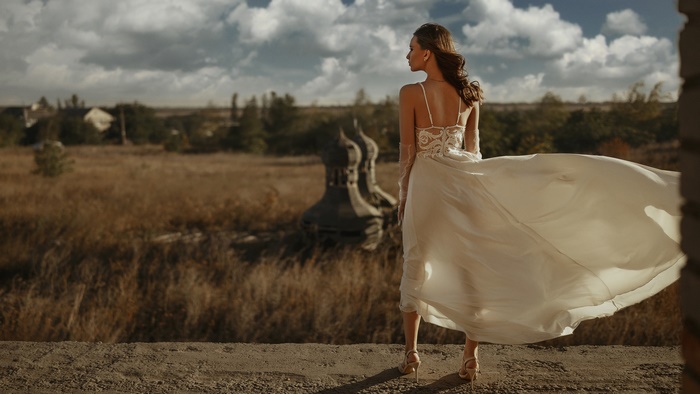 Woman in a wedding dress in a field