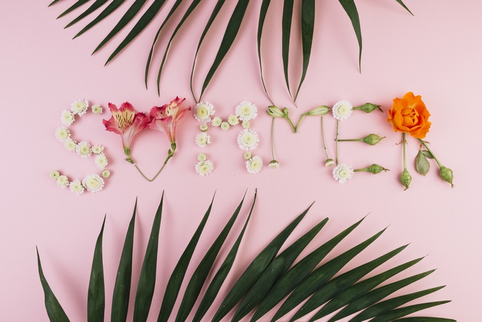 Summer word made of flowers and leaves
