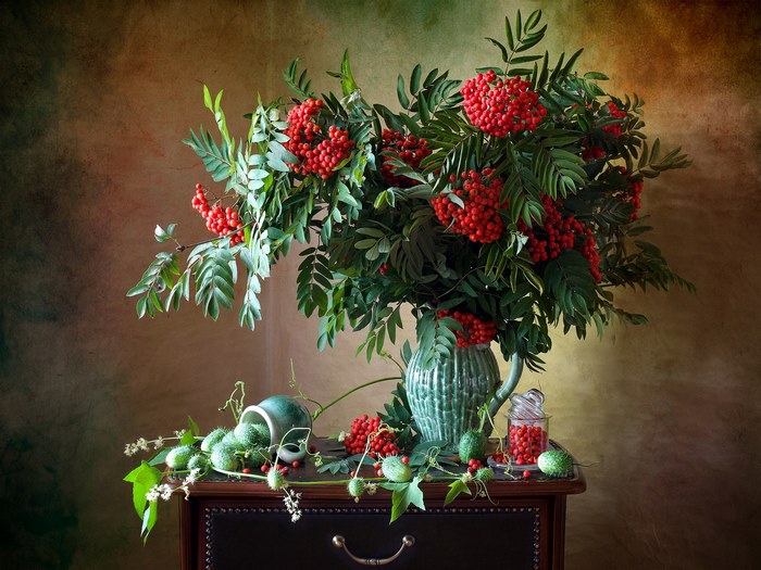 Still life with rowan berries and cucumbers