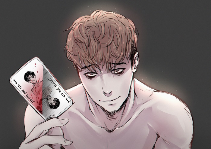 Oh Sangwoo holding a Joker card