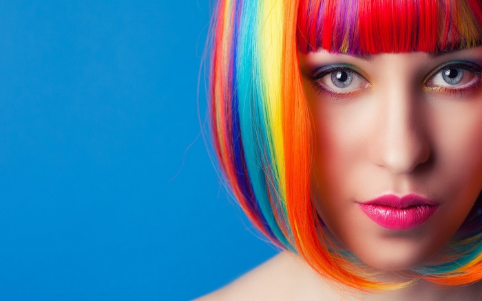 Woman with Vibrant Rainbow Hair and Blue Eyes
