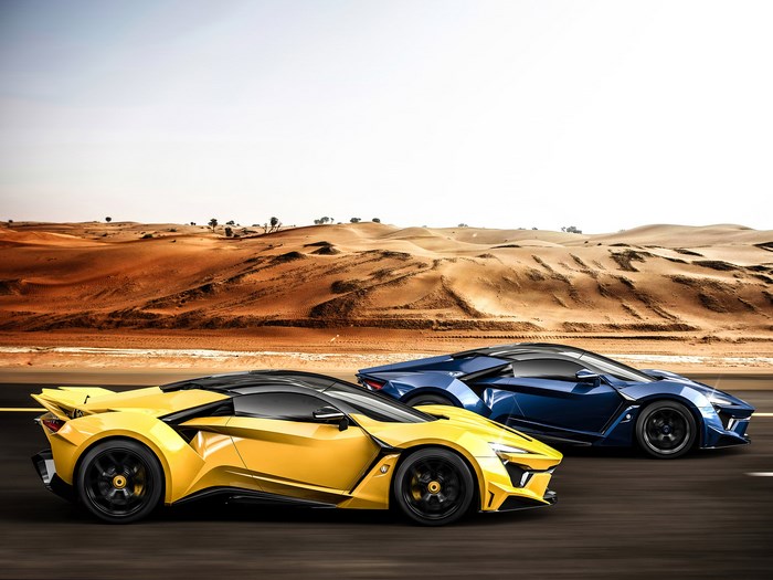 Yellow and Blue Fenyr SuperSport cars in desert