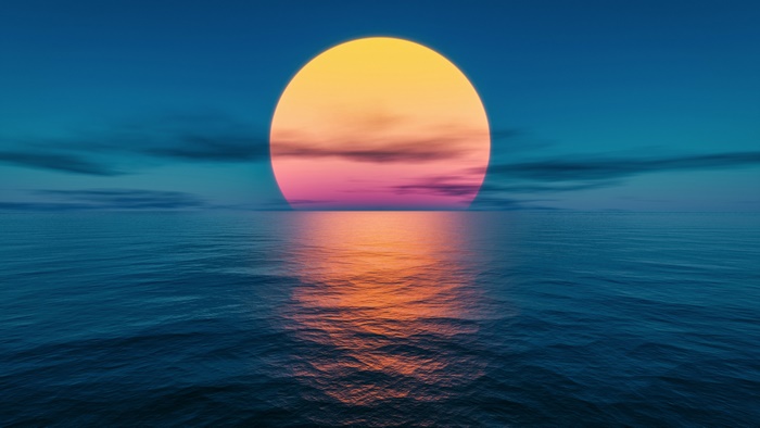 Sunset over the ocean with reflection