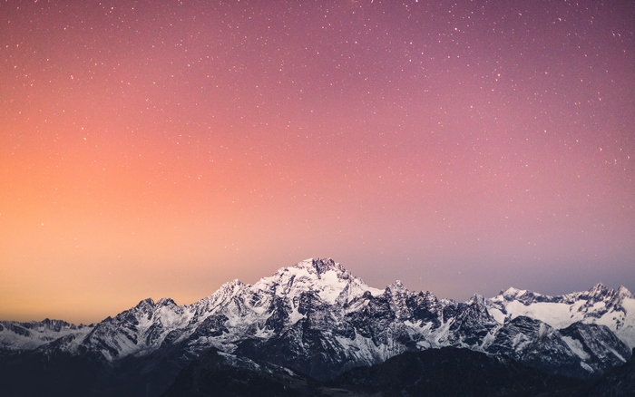 Snowy Mountains Under a Starry Sky 4K