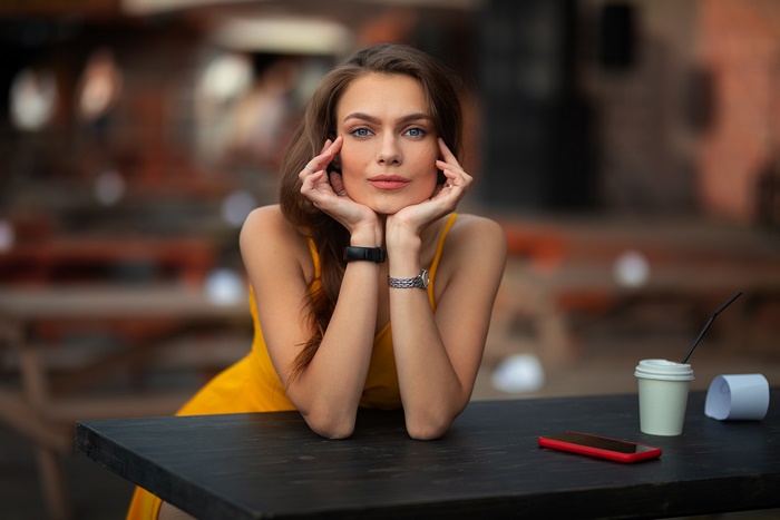 Woman with blue eyes in a yellow dress