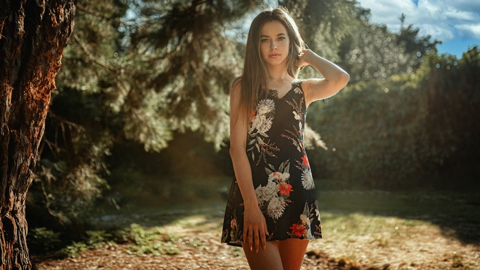 Brunette Woman in Floral Dress Outdoors