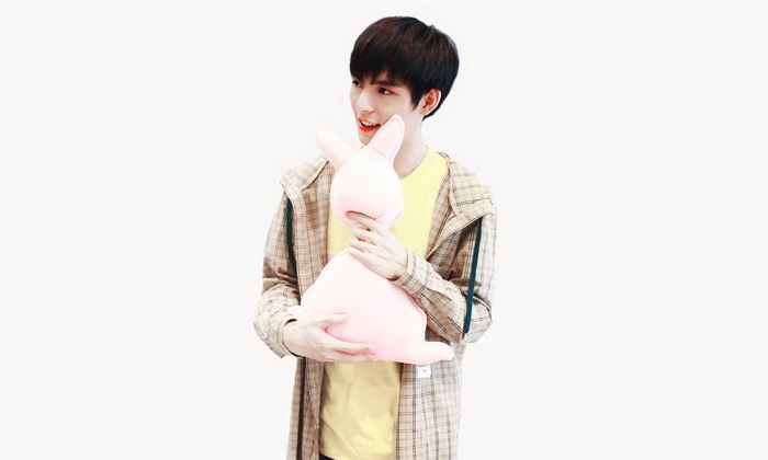 Wang Hao Xuan holding a pink bunny plush