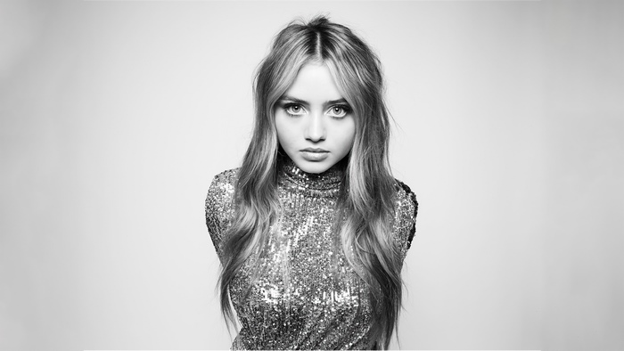Woman in sequined dress, black and white portrait