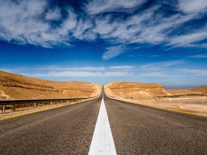 Desert Road with Mountains and Sky