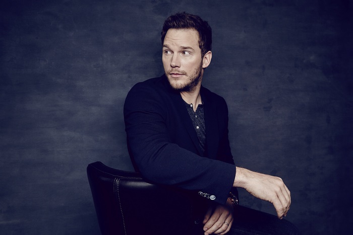 Chris Pratt sitting in a chair