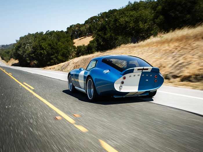 Blue Renovo Coupe driving on a road