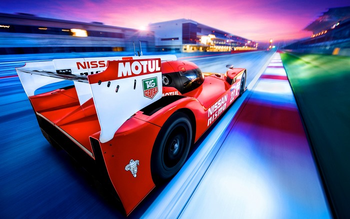Red Nissan GT-R LM Nismo race car on track