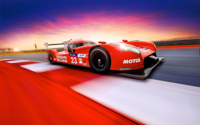 Red Nissan GT-R LM Nismo race car on track