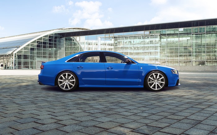 Blue Audi S8 Talladega S parked outside modern building