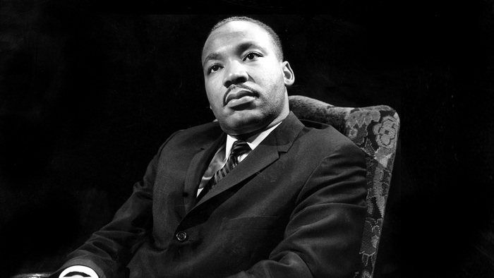 Martin Luther King Jr. sitting in a chair