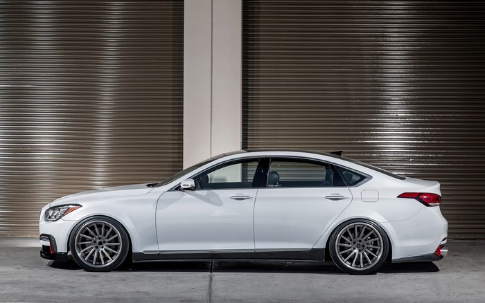 White Hyundai Genesis Sedan with custom wheels